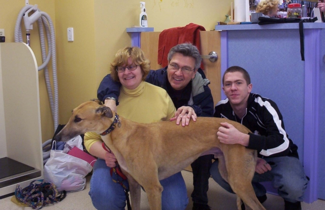 Tim Rogers family: His wife, Tim, his son. They rescued a greyhound (a dog, not a bus).