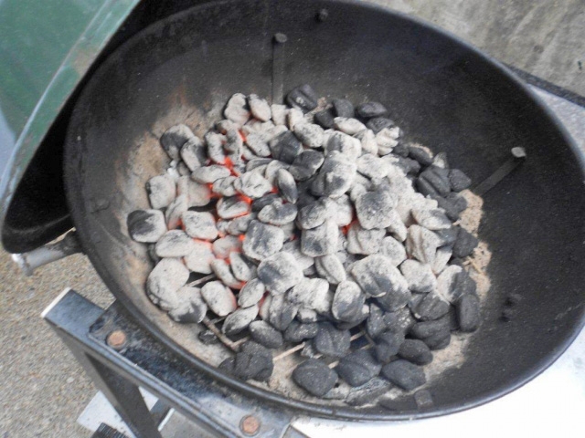 Coals warming to cook the great sausage