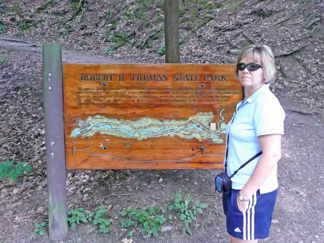 Robert Treman (aka Enfield) State Park. [Terri Holland] pointing out the sign.